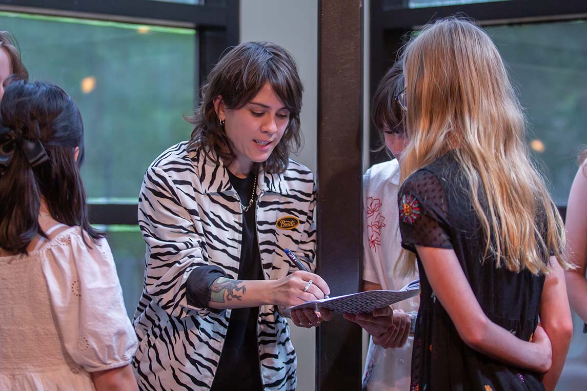 Tegan-signing-book